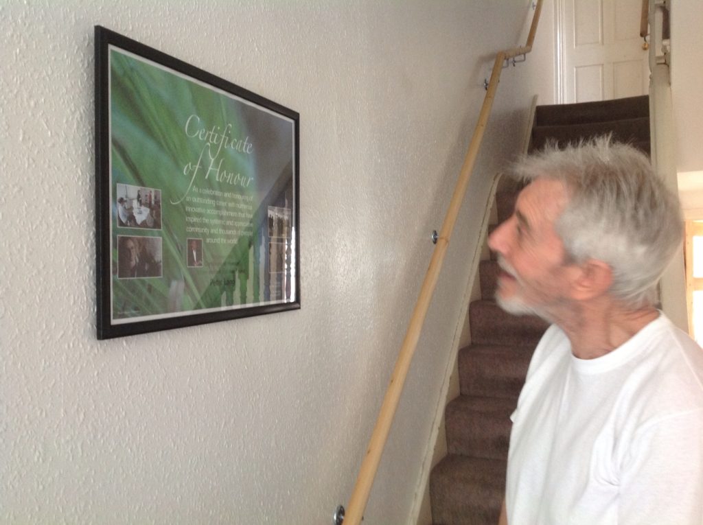 Peter looking at the certificate from the Peter Lang Foundation 2013 Peter Lang July 2013